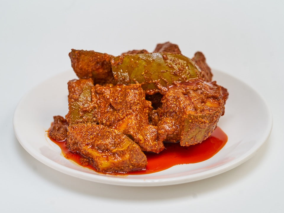 Girija Paati's Avakkai recipe is one that her family has guarded closely for over a century. Order now on www.girijapaati.com . Made with whole back pepper and a grandmother's love - Girija Paati - paati means grandmother in Tamil